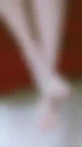 I slowly play with my feet, letting them slide while my gaze asks you to come see me.