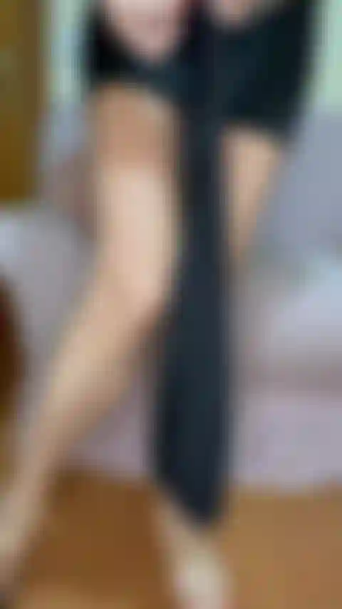 Sensuelle avec des bas et des talons.