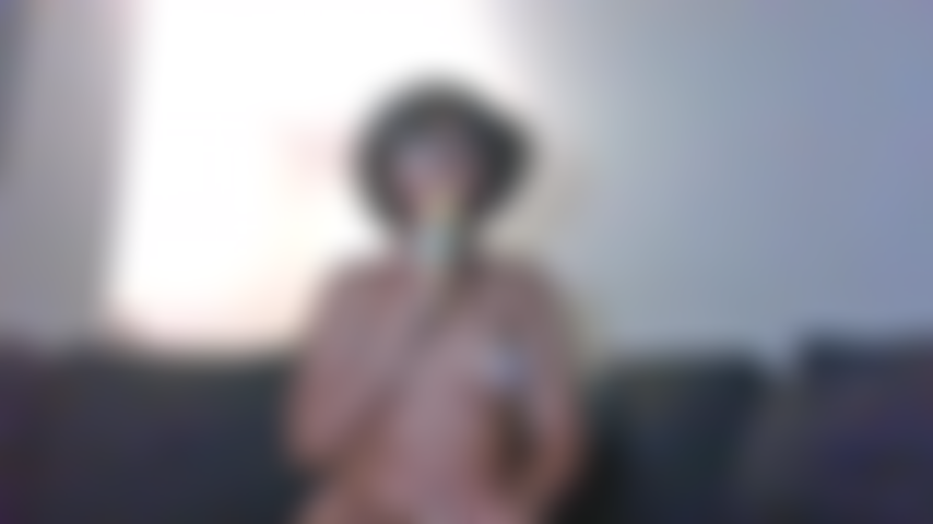 Topless ebony with lollipop