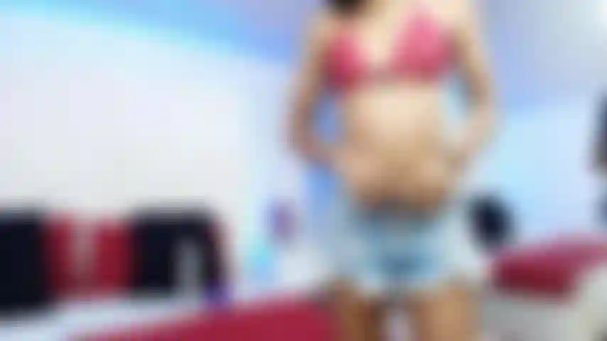 Your lady in red enjoys taking off her clothes and