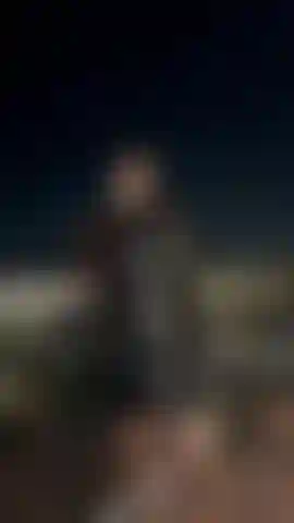 Latex Military Mistress on a Balcony smoking