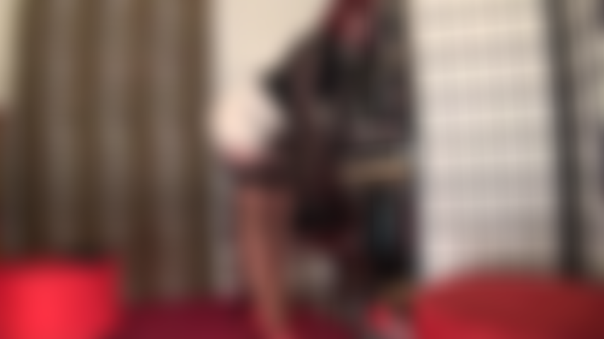 In silky stockings and garters with a massive black strapon.