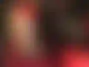 Jolie culotte rose en satin dos nu sous une paire de collants rayés nude très transparents.