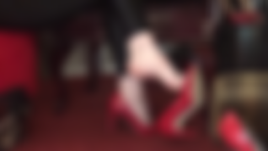 Barefoot tease - Bare feet in red leather pumps, toes, dangling