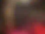 Maîtresse vêtue de cuir noir.