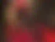 Maîtresse porte une séduisante robe rouge moulante et courte avec des collants noirs et des bottes courtes brillantes, des gants et un chapeau en cuir, taquinant votre bite dure. Tellement sexy !