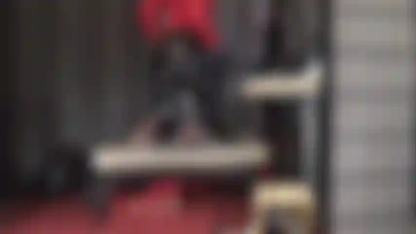 Feet are twirling, ass is wiggling in shiny pvc pants and dark brown pantyhose. Panties optional.