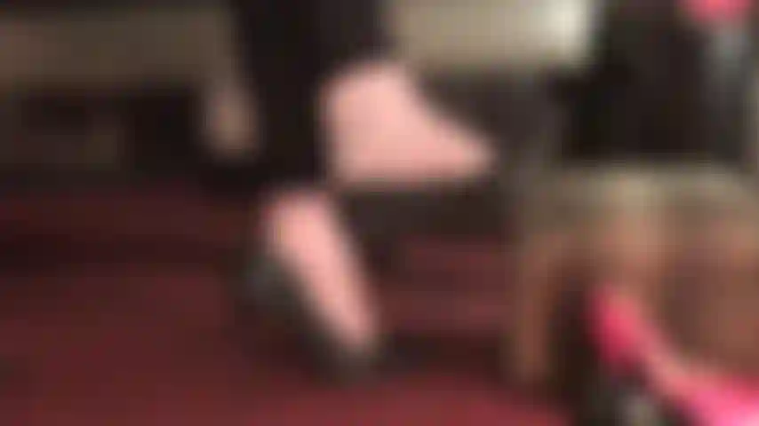 Mistress has you captivated by her bare feet, dangling studded leather pumps.