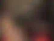 Cagoule en caoutchouc chaude pour compléter une tenue sexy en latex vert fumé, jupe, chemisier et bas.