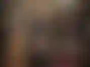 Maîtresse en cuir avec un gros gode ceinture blanc - sous cette belle longue jupe et ce manteau en cuir se trouve une de mes bites que tu dois faire plaisir avec ta jolie petite bouche de pédé suceur de bite.