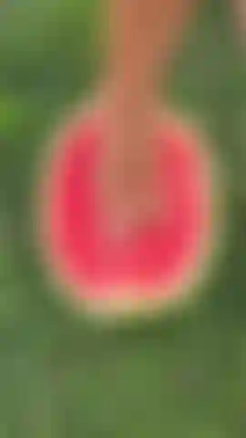 Stepping on a watermelon barefoot