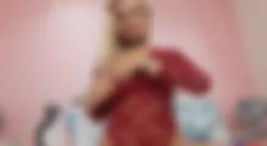 Sucking_my_dildo_in_a_red_outfit_teasing_you_big_tits.