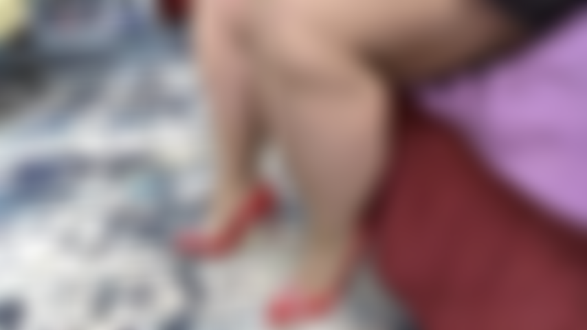 Red_pumps_&_tan_thigh_highs_taping_foot_like_its_on_a_gas_pedal.